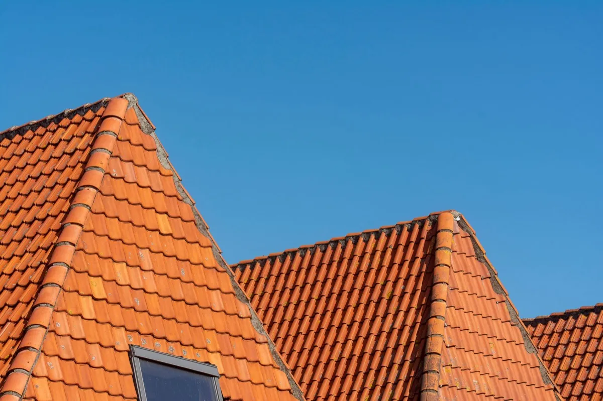 Clay barrel tile rooflines on homes in Elgin, IL